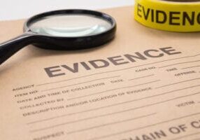 magnifying glass and evidence bag for crime scene investigation